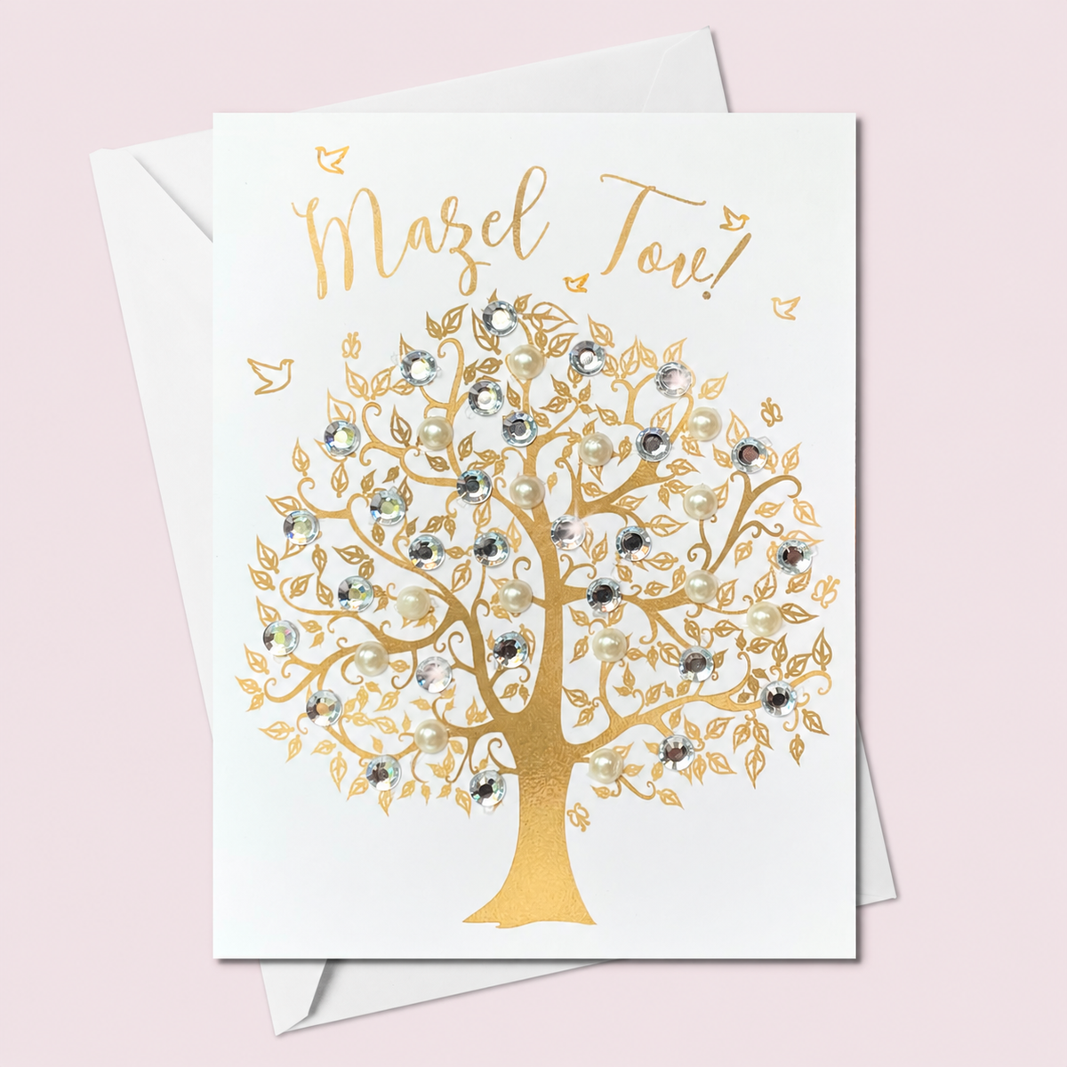 Mazel Tov gold tree greeting card on a pale pink background