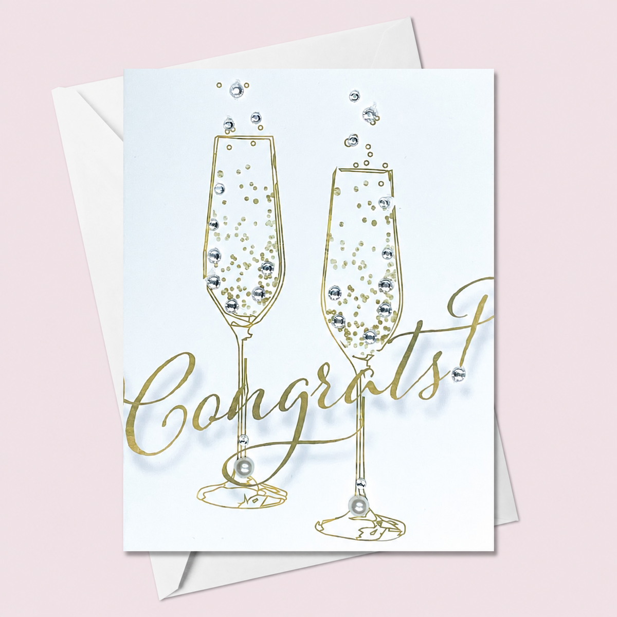 Congratulations champagne glasses card on a pale pink background