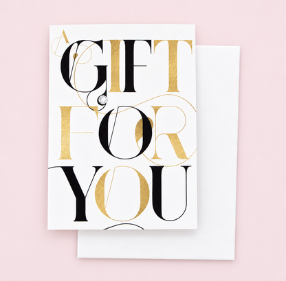 A Gift For You (Bold) Greeting Card Mini Size with white envelope on a pale pink background