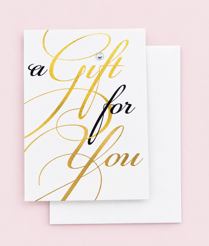 A Gift For You Greeting Card Mini Size with white envelope on a pale pink background