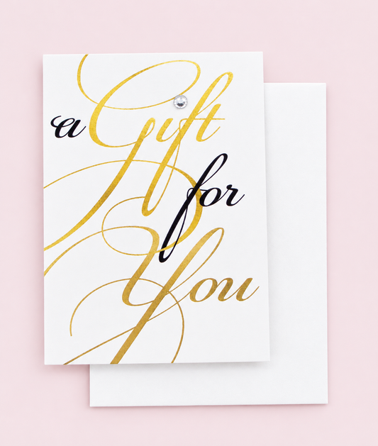 A Gift For You Greeting Card Mini Size with white envelope on a pale pink background