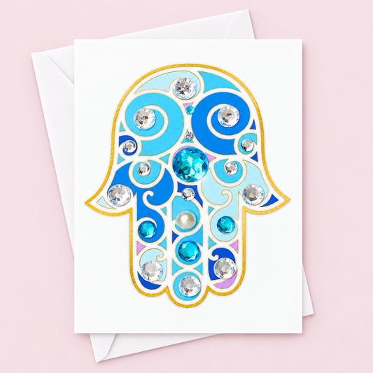 Blue and Gold Hamsa Greeting Card greeting card with its original design, shown with a white envelope on a pale pink background