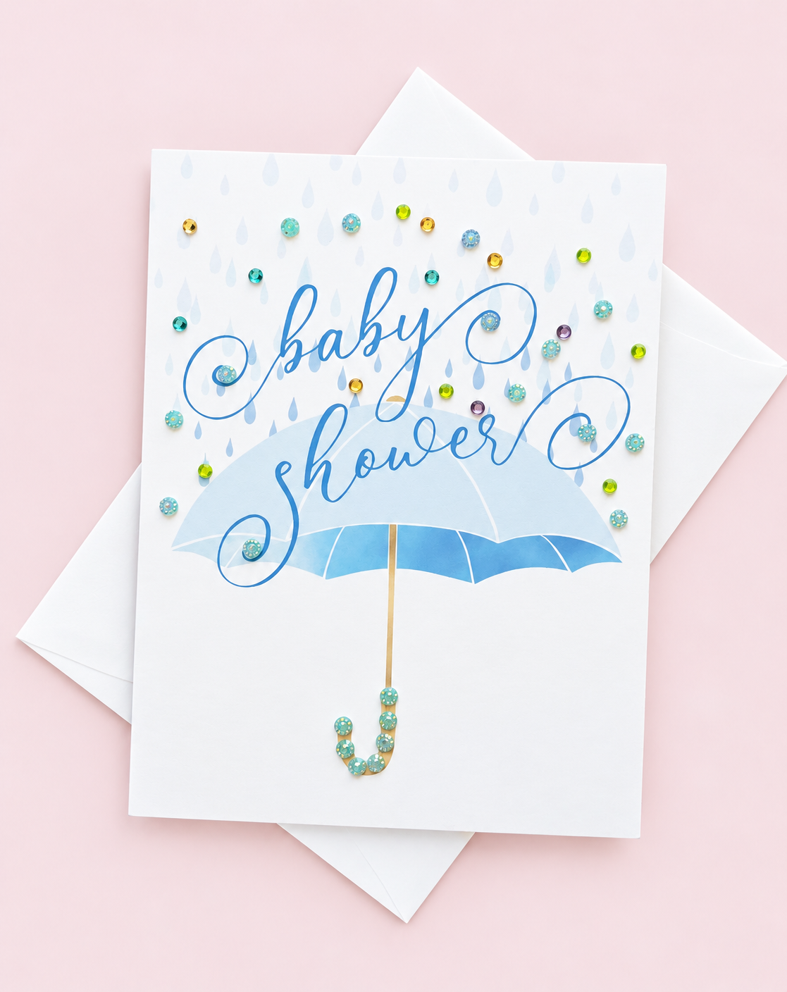 Blue Baby Shower Umbrella Greeting Card greeting card with its original design, shown with a white envelope on a pale pink background