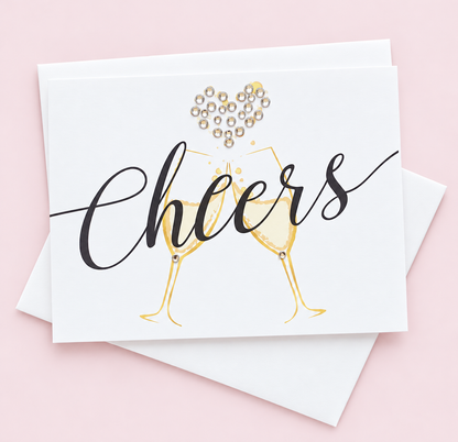 Cheers Champagne Greeting Card greeting card with its original design, shown with a white envelope on a pale pink background
