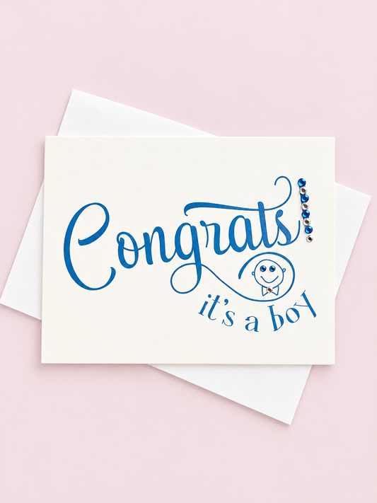Congrats Its a Boy greeting card with hand-applied sparkling details with a white envelope on pale pink