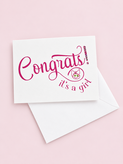 Congrats Its a Girl greeting card with hand-applied sparkling details with a white envelope on pale pink