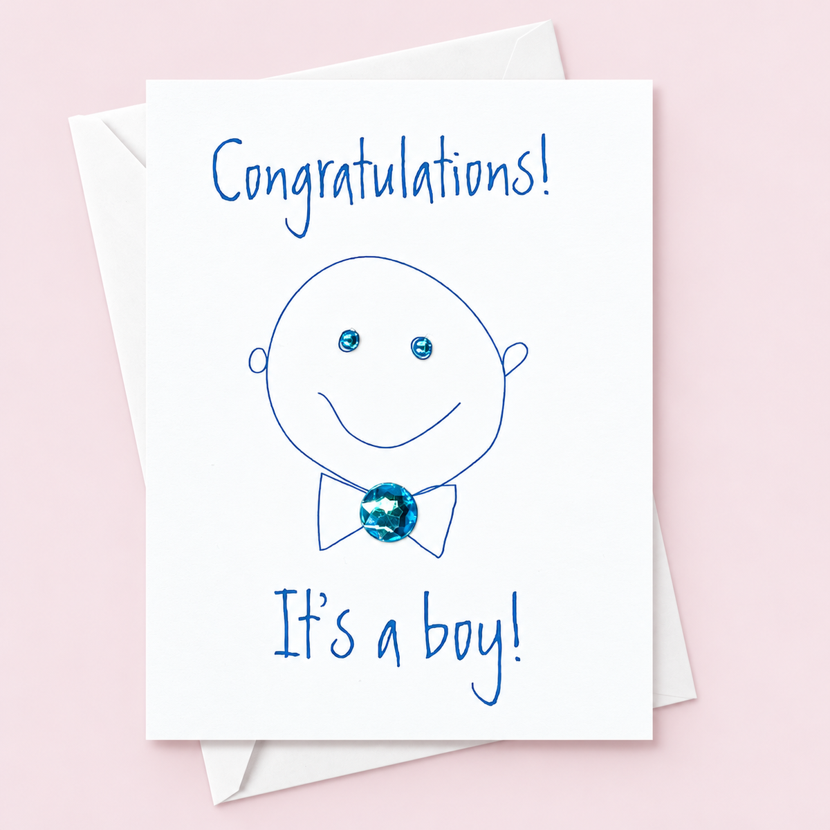 Congratulations Its a Boy greeting card with hand-applied sparkling details with a white envelope on pale pink