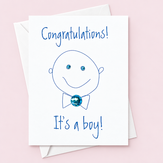 Congratulations Its a Boy greeting card with hand-applied sparkling details with a white envelope on pale pink