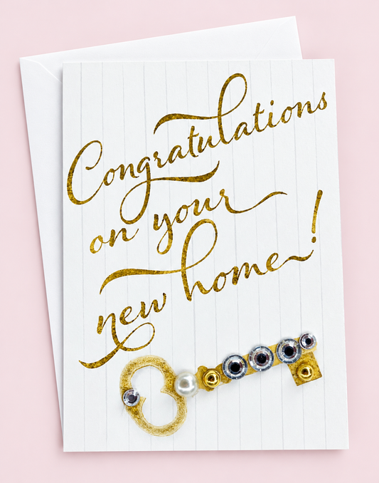 Congratulations on your new home mini with a white envelope on a pale pink background