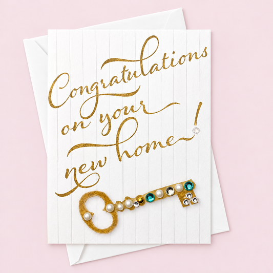 Congratulations on your new home! with a white envelope on a pale pink background