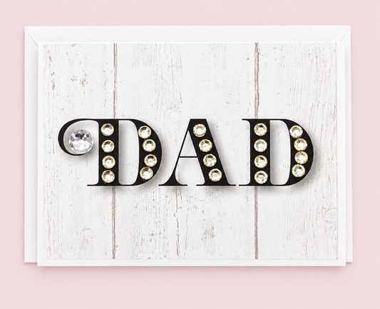 Dad Black with White Sparkle Greeting Card with white envelope on a pale pink background