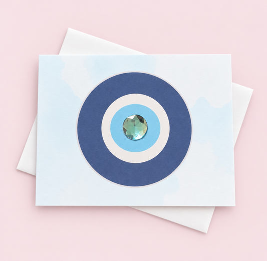 Evil Eye Protection Minimalist greeting card with its original design, shown with a white envelope on a pale pink background