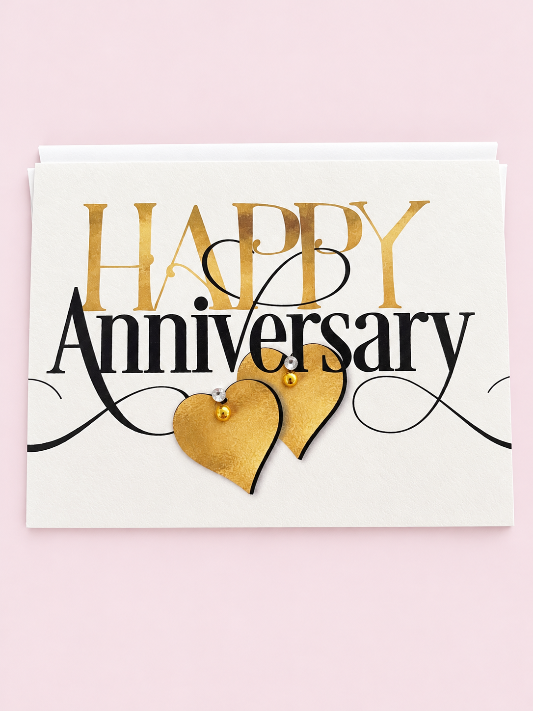 Happy Anniversary ❤️❤️ with a white envelope on a pale pink background