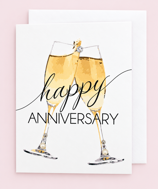 Happy Anniversary Champagne Greeting Card with white envelope on a pale pink background