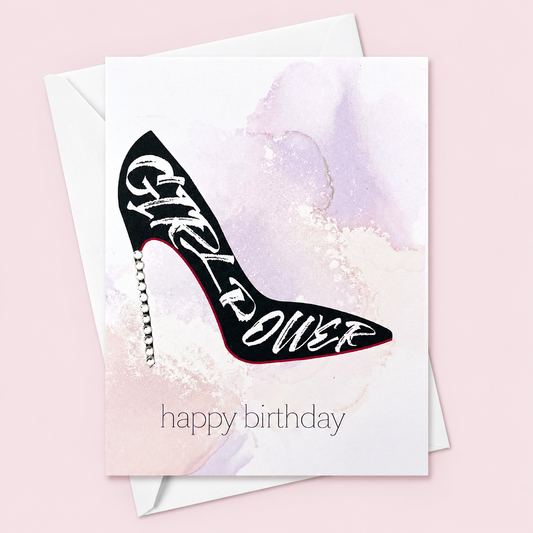 Happy Birthday Girl Power greeting card with hand-applied sparkling details with a white envelope on pale pink