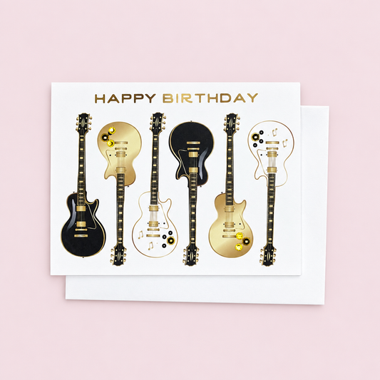 Happy Birthday Guitar Greeting Card with white envelope on a pale pink background
