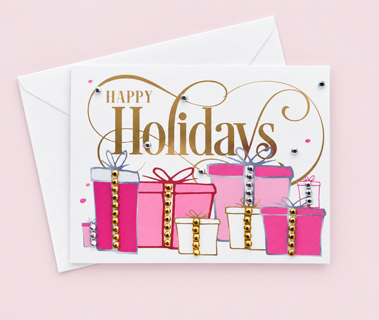 Happy Holiday present greeting card with sparkling hand-applied details with a white envelope on pale pink