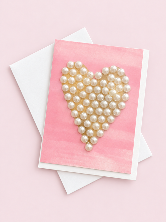 Heart Pearl greeting card with its original design, shown with a white envelope on a pale pink background