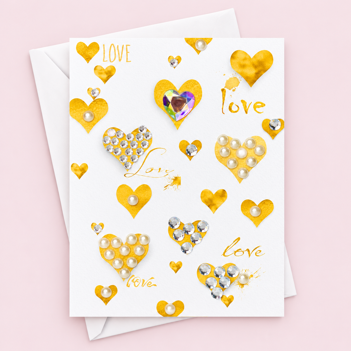 Gold Hearts and Love Greeting Card greeting card with its original design, shown with a white envelope on a pale pink background