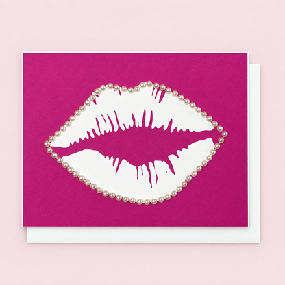 Lips & Pearls with a white envelope on a pale pink background