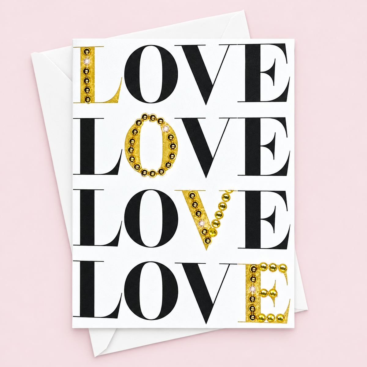 Love Love Love Love with a white envelope on a pale pink background