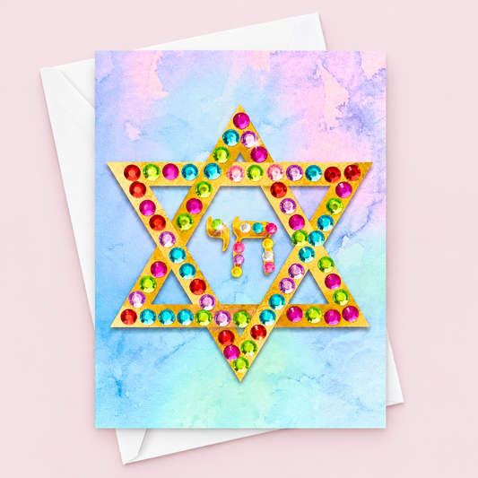 Magen David | Star of David Greeting Card - Colourful greeting card with its original design, shown with a white envelope on a pale pink background