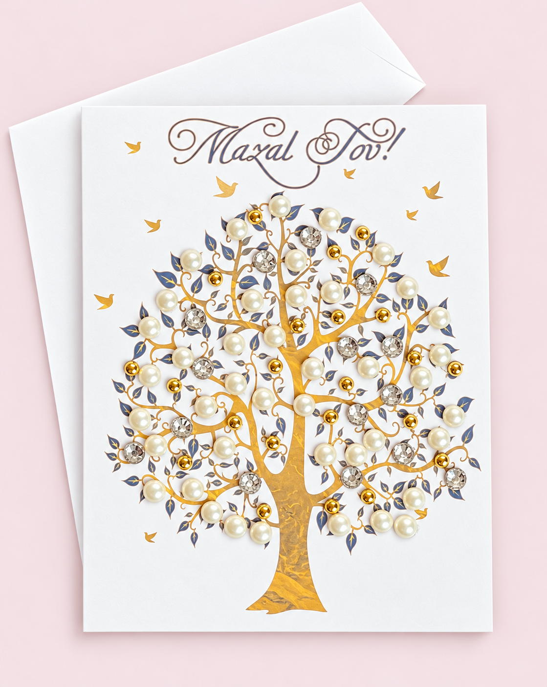 Mazal Tov Tree in Gold greeting card with its original design, shown with a white envelope on a pale pink background