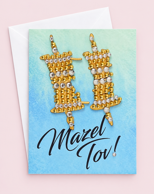 Mazel Tov Bar/Bat Mitzvah Gold Torah Scroll on Blue Watercolour Background greeting card with its original design, shown with a white envelope on a pale pink background