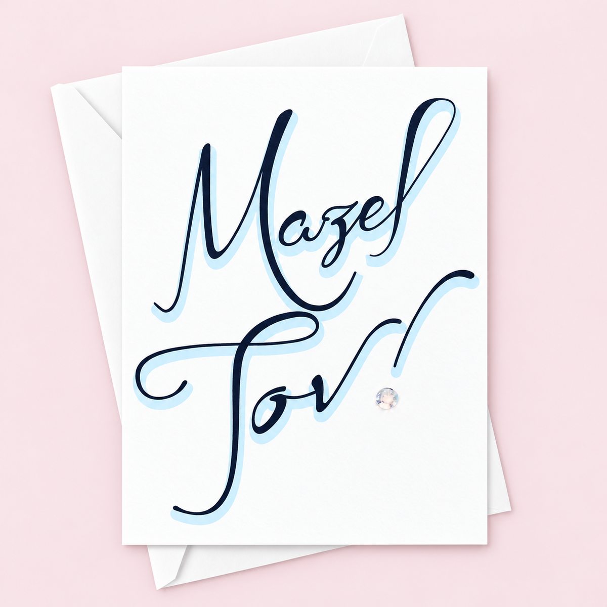 Mazel Tov Black and Blue Font greeting card with its original design, shown with a white envelope on a pale pink background