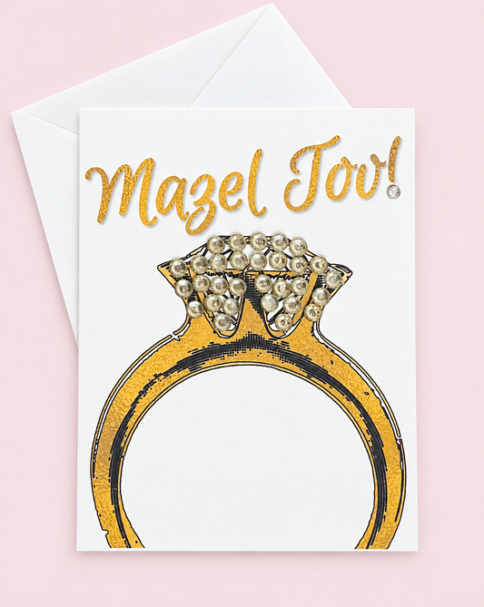 Mazel Tov Engagement Ring greeting card with its original design, shown with a white envelope on a pale pink background