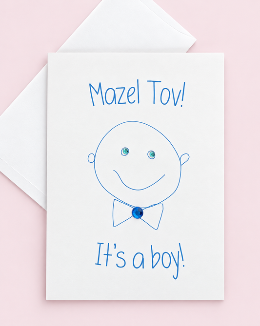 Mazel Tov! It's a Boy! greeting card with its original design, shown with a white envelope on a pale pink background
