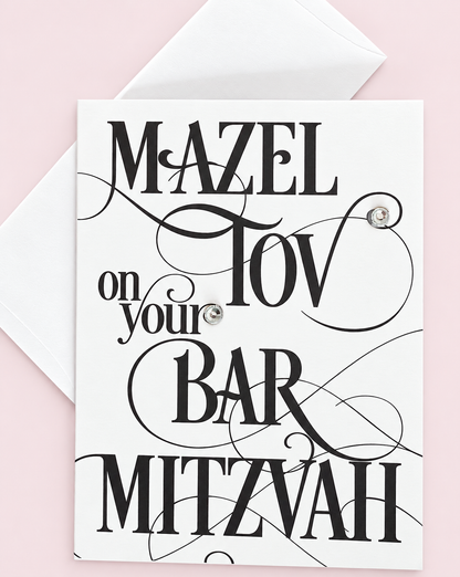 Mazel Tov on Your Bar Mitzvah Black Script greeting card with its original design, shown with a white envelope on a pale pink background