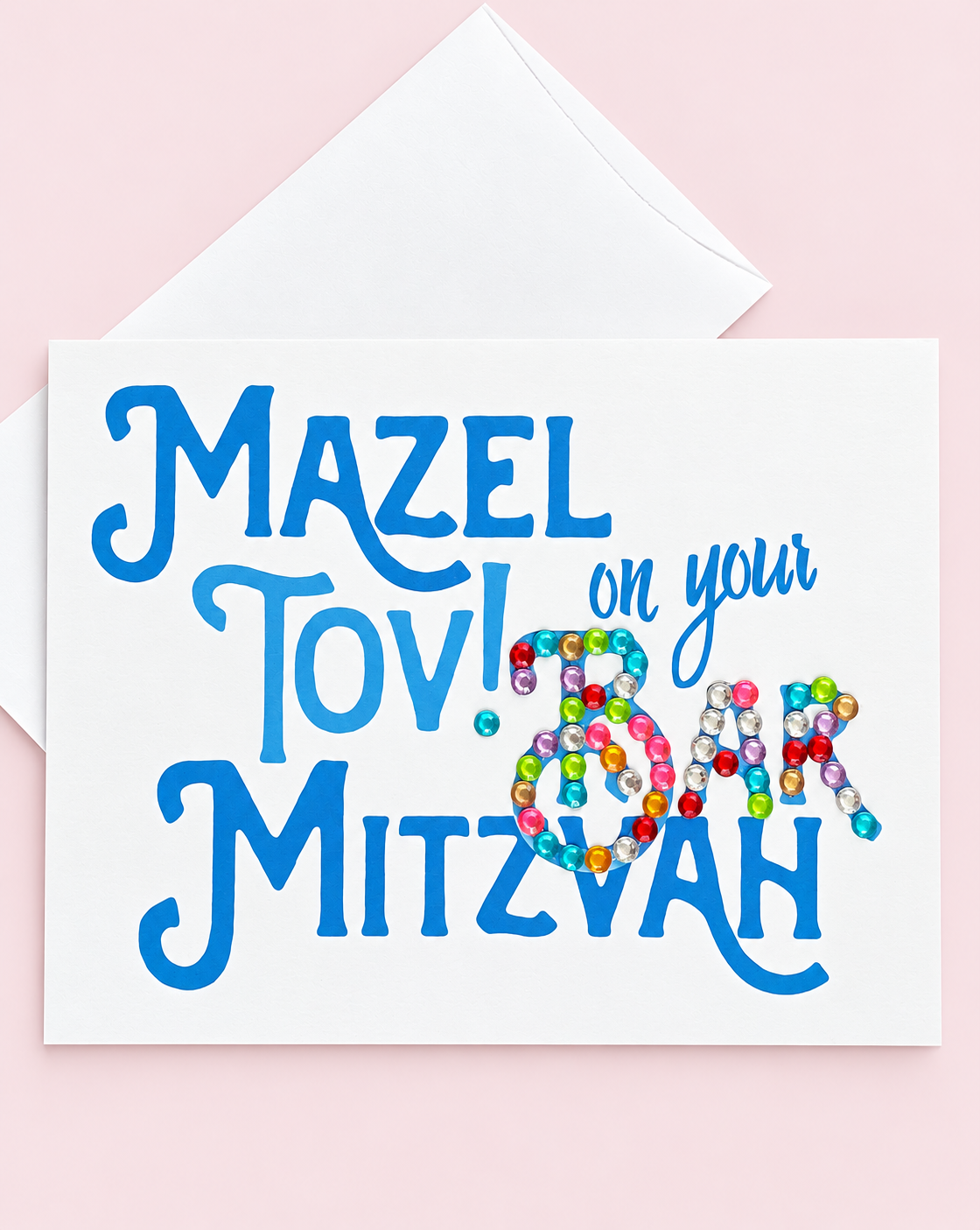 Mazel Tov on your Bar Mitzvah Blue greeting card with its original design, shown with a white envelope on a pale pink background
