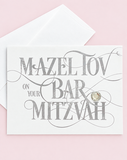 Mazel Tov on your Bar Mitzvah Silver Script greeting card with its original design, shown with a white envelope on a pale pink background