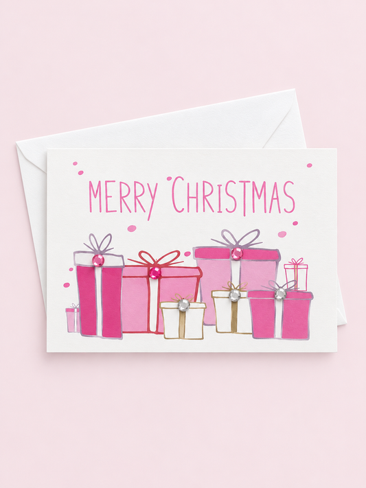 Merry Christmas mini with a white envelope on a pale pink background