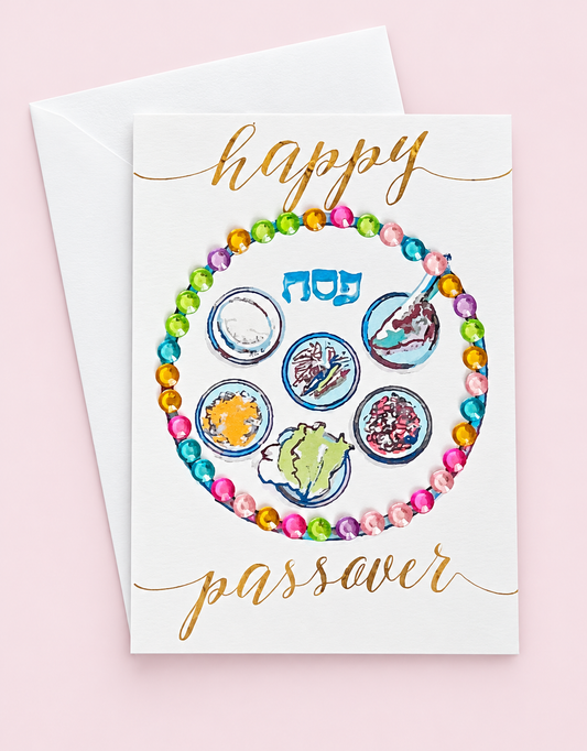 Mini Happy Passover Multicolour Sedar Plate greeting card with its original design, shown with a white envelope on a pale pink background
