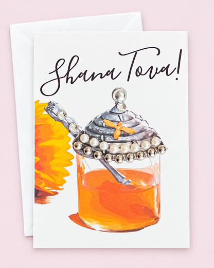 Mini Shana Tova Honey Pot greeting card with its original design, shown with a white envelope on a pale pink background