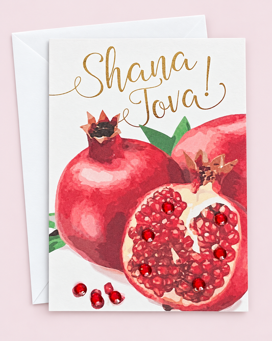 Mini Shana Tova Pomegranate Cluster greeting card with its original design, shown with a white envelope on a pale pink background