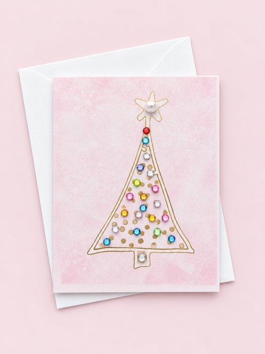 Mini tree with a white envelope on a pale pink background
