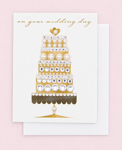 On Your Wedding Day Gold Cake Greeting Card with white envelope on a pale pink background