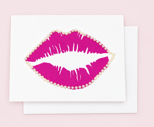 Sealed With A Kiss Greeting Card with white envelope on a pale pink background