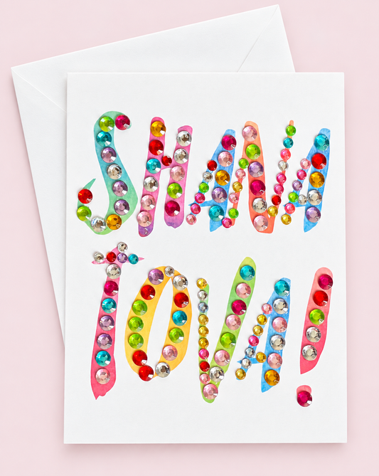 Shana Tova! Colourful Letters Card Vertical greeting card with its original design, shown with a white envelope on a pale pink background