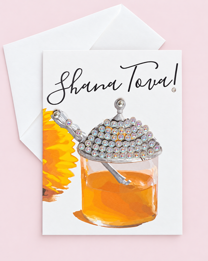 Shana Tova Honey Pot greeting card with its original design, shown with a white envelope on a pale pink background