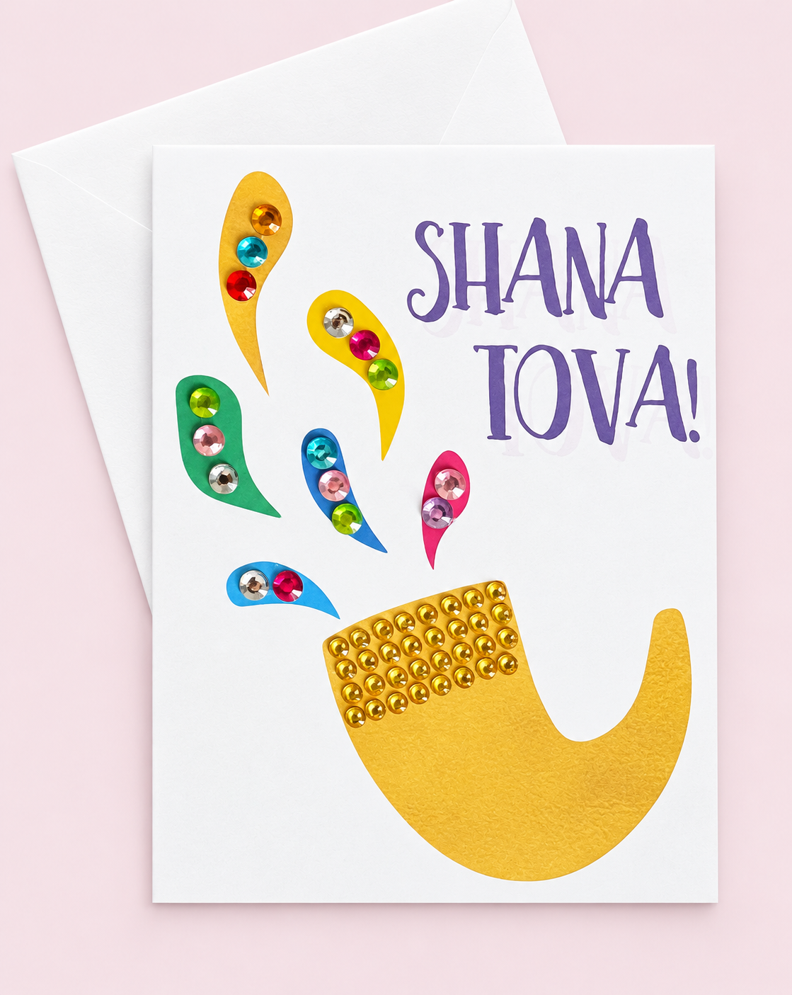 Shana Tova! Rosh Hashanah Gold Shofar greeting card with its original design, shown with a white envelope on a pale pink background