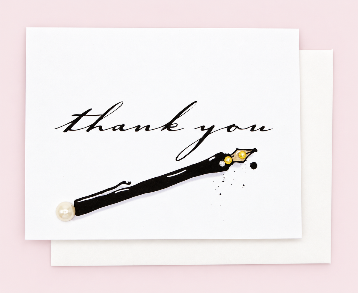 Thank You Black Pen Greeting Card with white envelope on a pale pink background