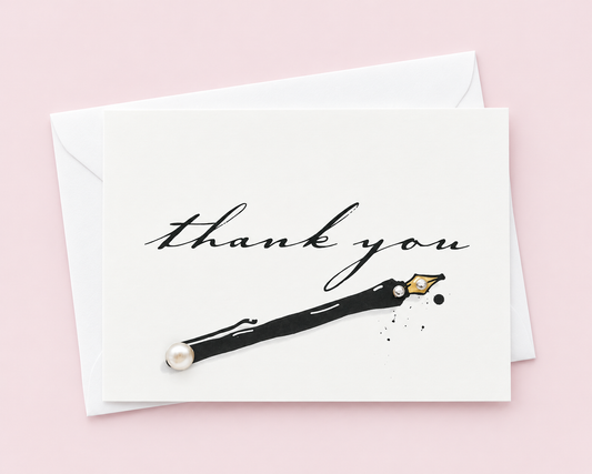Thanksgiving Greeting Cards - Thank you black pen with white envelope on a pale pink background
