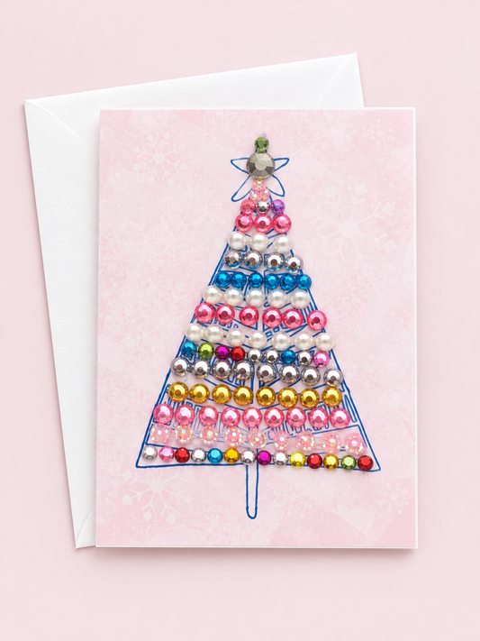 Tree mini with a white envelope on a pale pink background