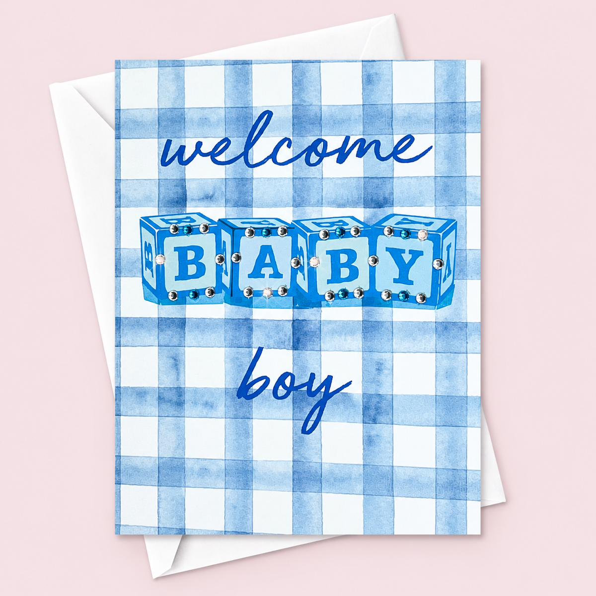Welcome Baby Boy with a white envelope on a pale pink background