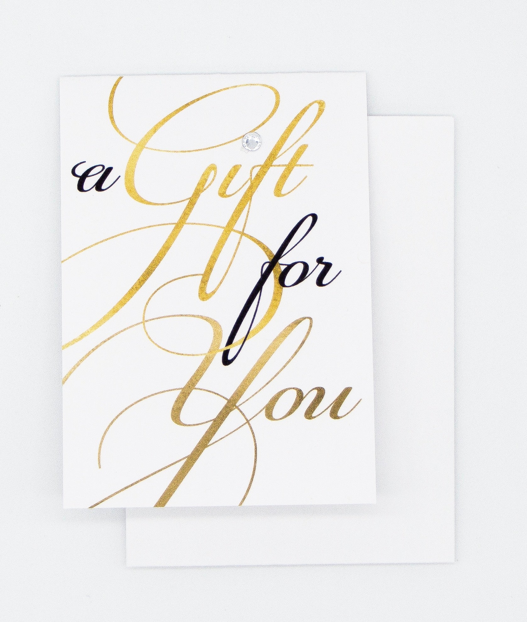 black and gold script writing saying a gift for you