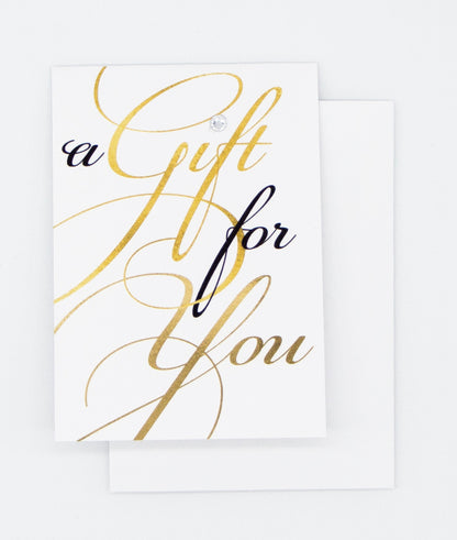 black and gold script writing saying a gift for you